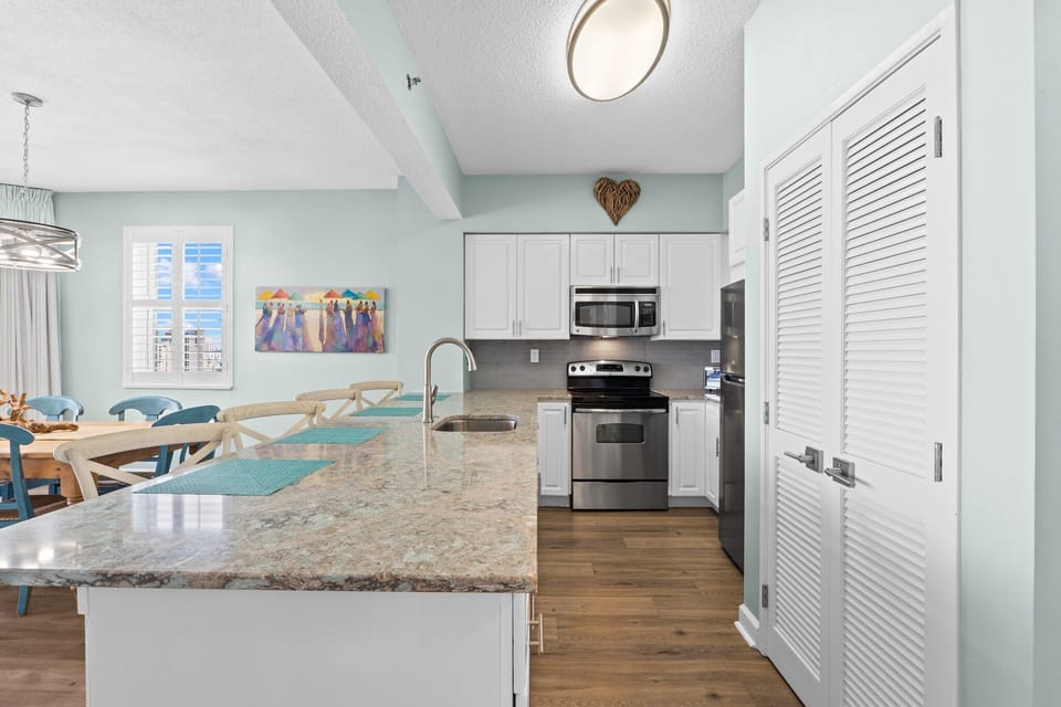 Explore the convenience of this fuly stocked kitchen that has everything needed. Just like home. The unit also has a washer and dryer for your convenience.