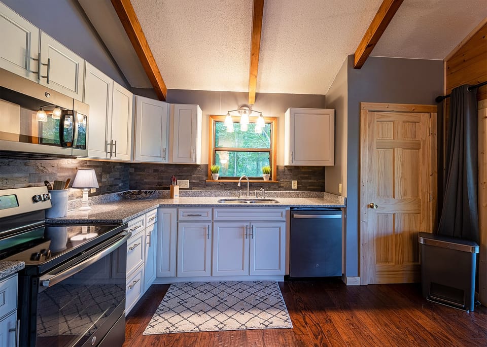 Mountain Oasis Cabin Rental - Living Room with Fully Equipped Kitchen