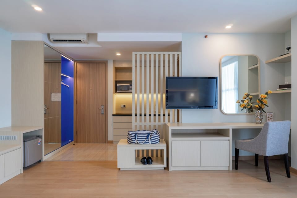Suite (Includes Free Laundry 2 pcs / day) | Living area | 32-inch LCD TV with satellite channels, TV