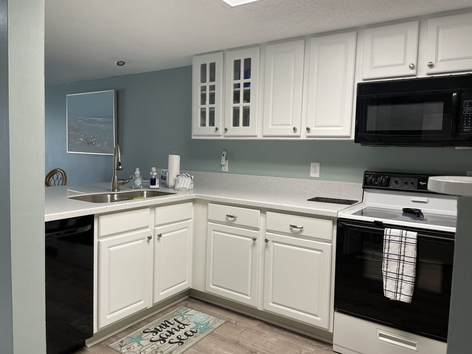 Updated kitchen with Corian countertops and new dishwasher