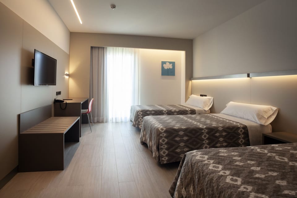 Triple Room | In-room safe, desk, soundproofing, free cribs/infant beds