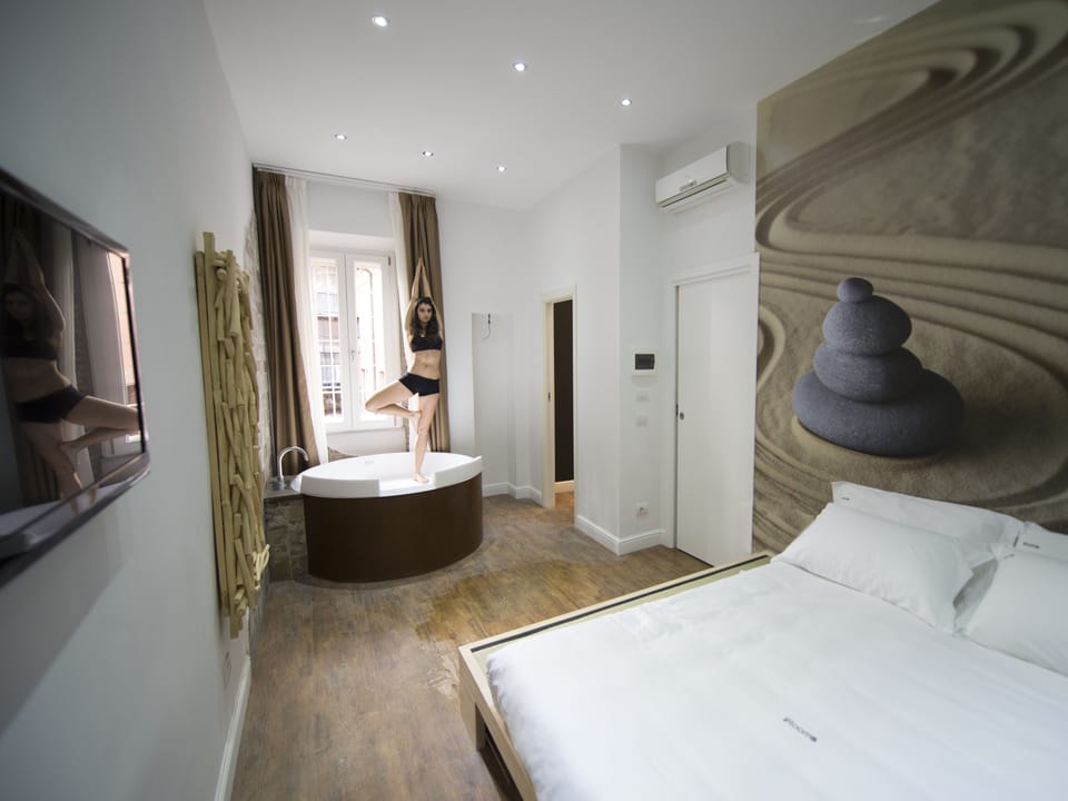 Frette Italian sheets, down comforters, memory foam beds, minibar