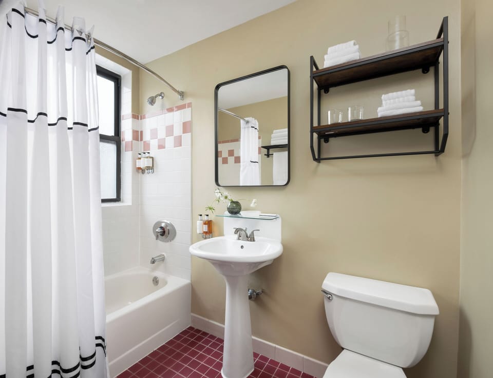 Combined shower/tub, free toiletries, hair dryer, bathrobes