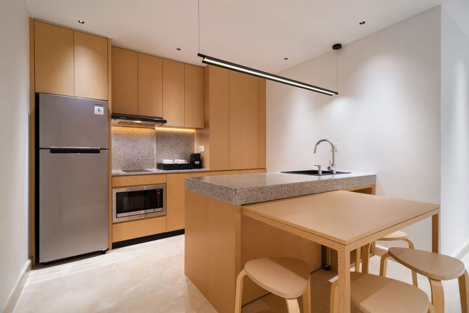 Deluxe Suite, 2 Bedrooms | Private kitchen | Fridge, microwave, coffee/tea maker, electric kettle