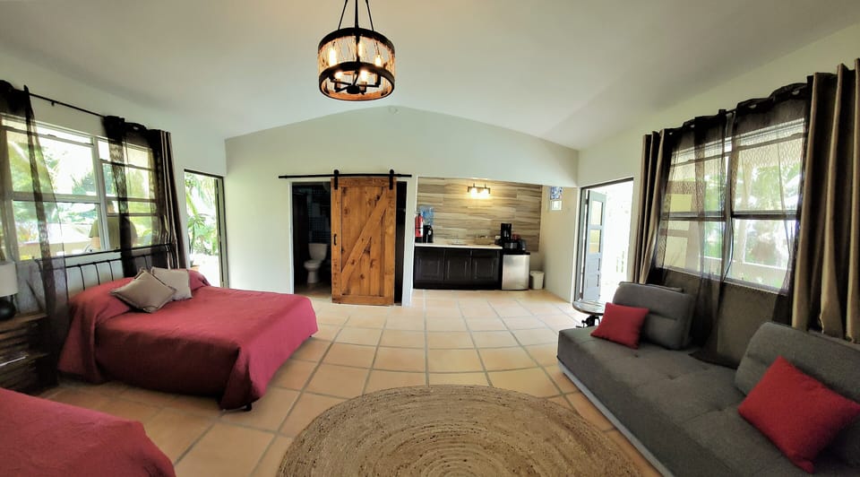Extra large room with 2 Queen beds, private bath, kitchenette & sitting area.