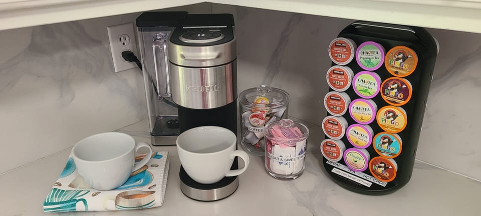 Coffee maker & pods provided.