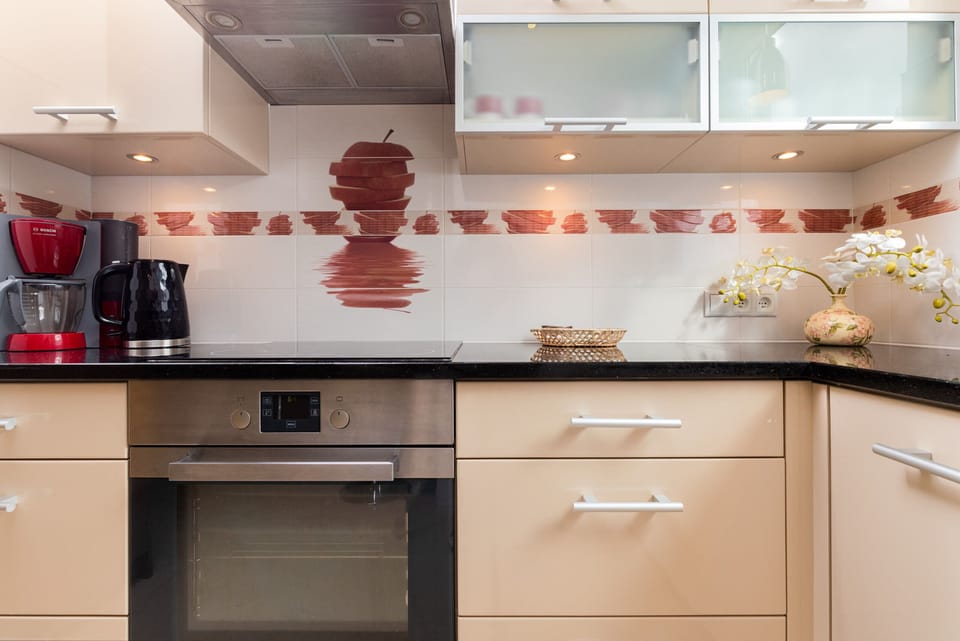 Functional kitchen with quality appliances such as oven, coffee machine, hob and dishwasher. The whole creates a harmonious space for home-cooked meals.
