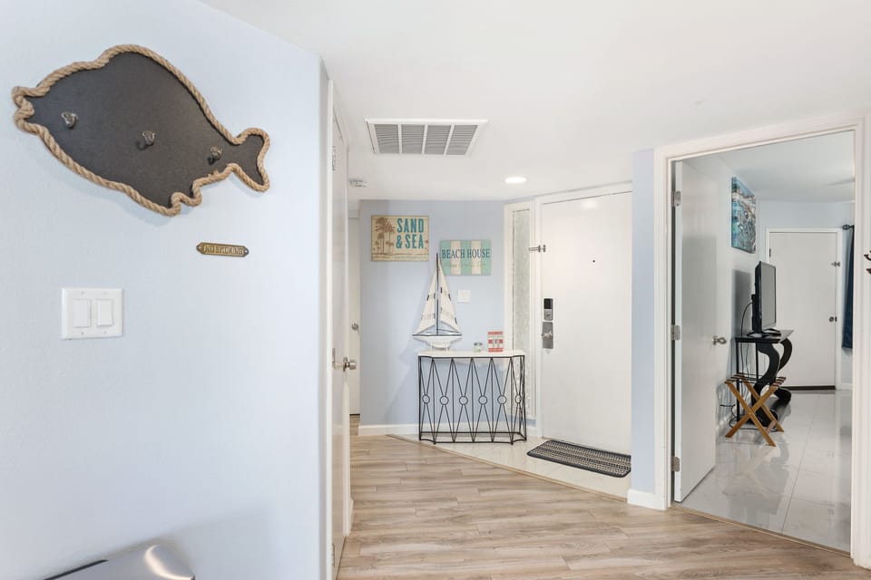 The hallway leads to the 3 bedrooms. 