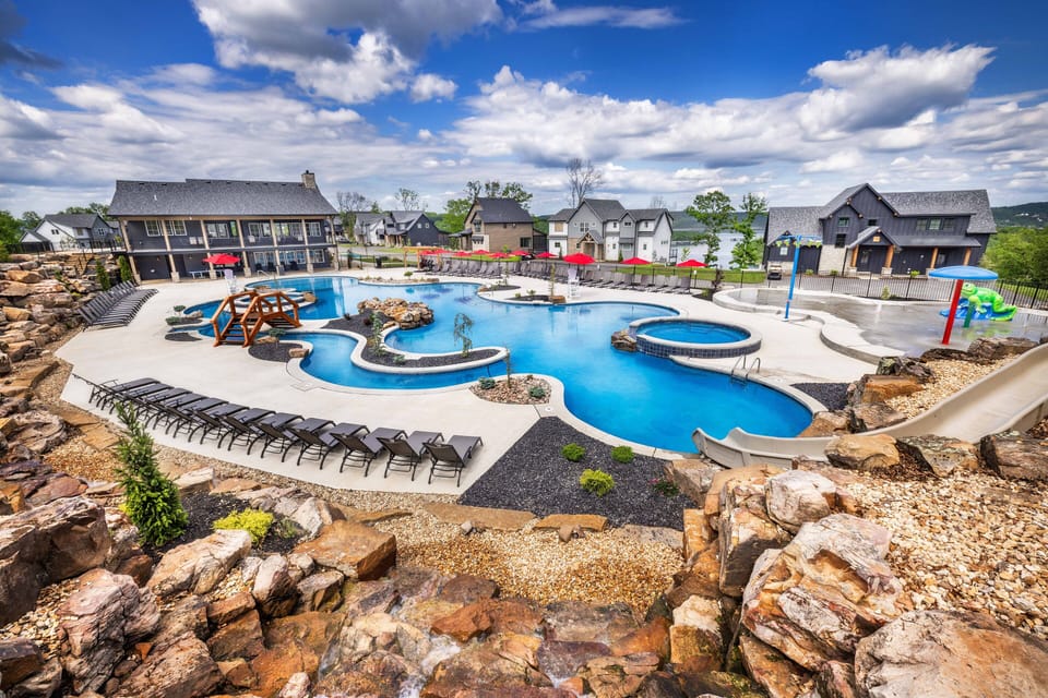 Our 5,000 sq ft main pool with a waterslide, two hot tubs, and a current channel.