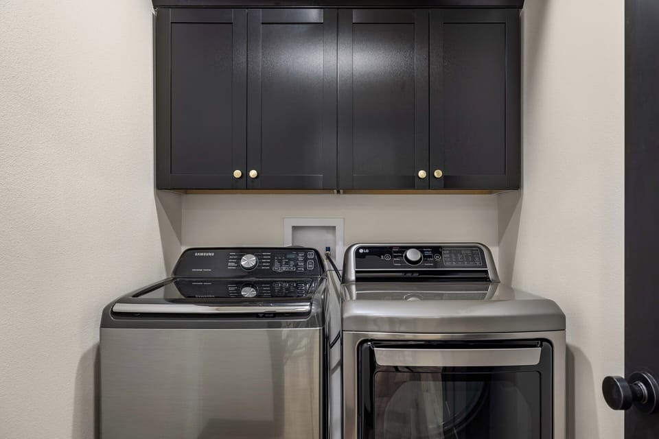 Laundry room between the upper level king suites