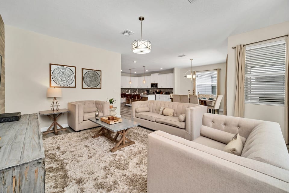 Sink into comfort in our inviting living room, where plush seating and warm decor create a welcoming ambiance for relaxation and quality time with loved ones.