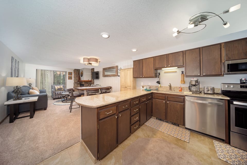 Your spacious kitchen flows seamlessly into the cozy living area, creating the perfect space for cooking and relaxing together.