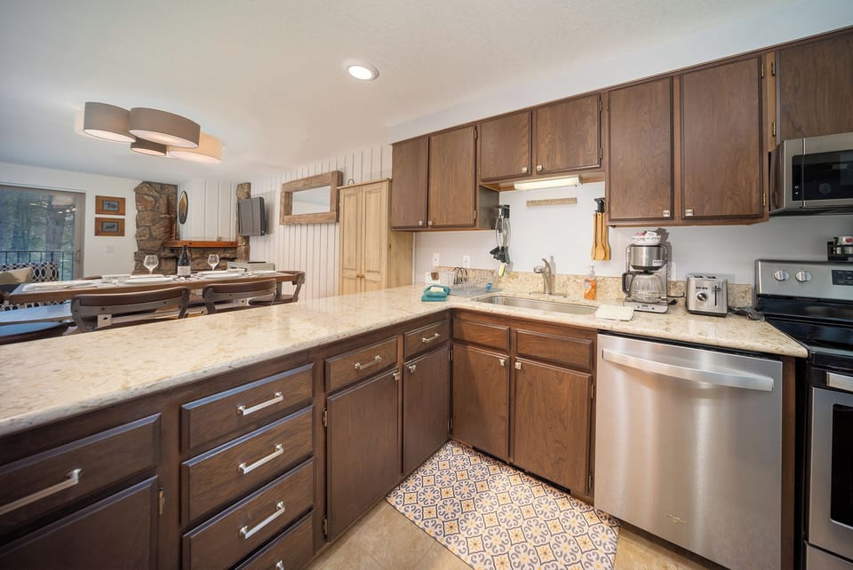 Your fully equipped kitchen awaits with granite countertops, stainless appliances, and everything needed to create memorable meals during your stay.