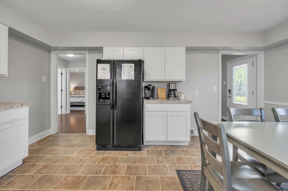 Well-appointed kitchen fully stocked with cookware, utensils, and essentials, perfect for preparing meals and enjoying home-style dining.
