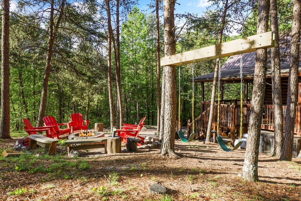 Outdoor space with a firepit, swings and plenty of space