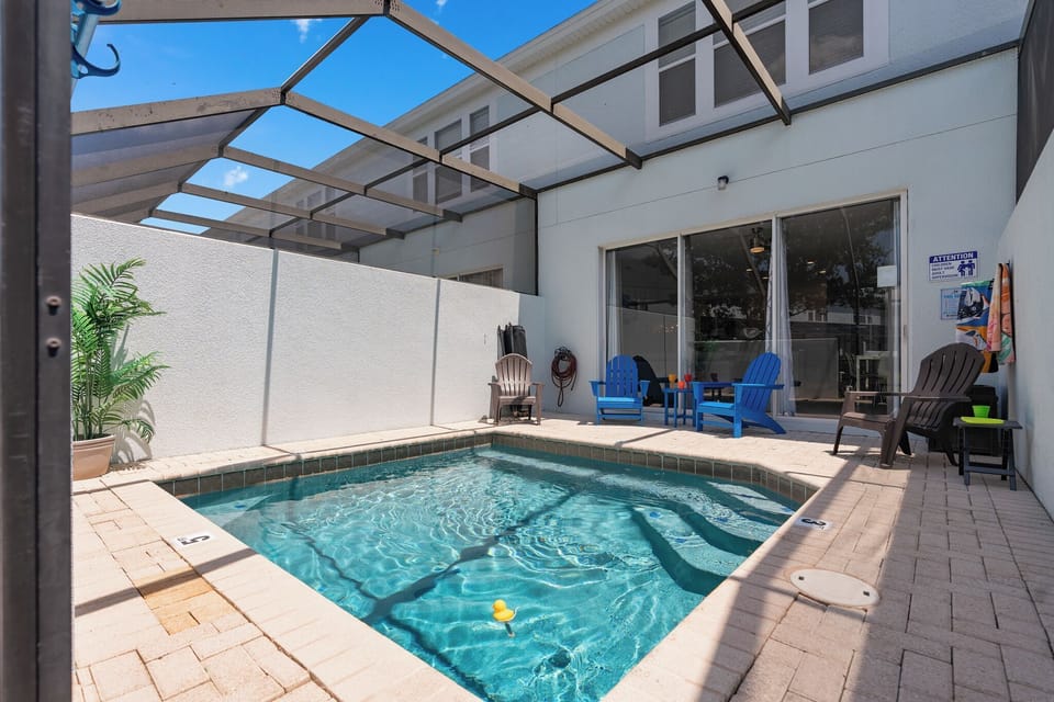 Private heated plunge pool and screened lanai with comfortable seating, plus a removable safety fence for added family peace of mind.