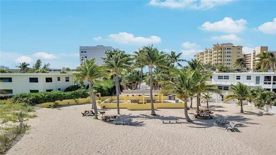 Just a 5 minute walk, enjoy the quiet private beach area with ample beach space, parking, showers, charcoal grills, a covered pavilion and dining tables.