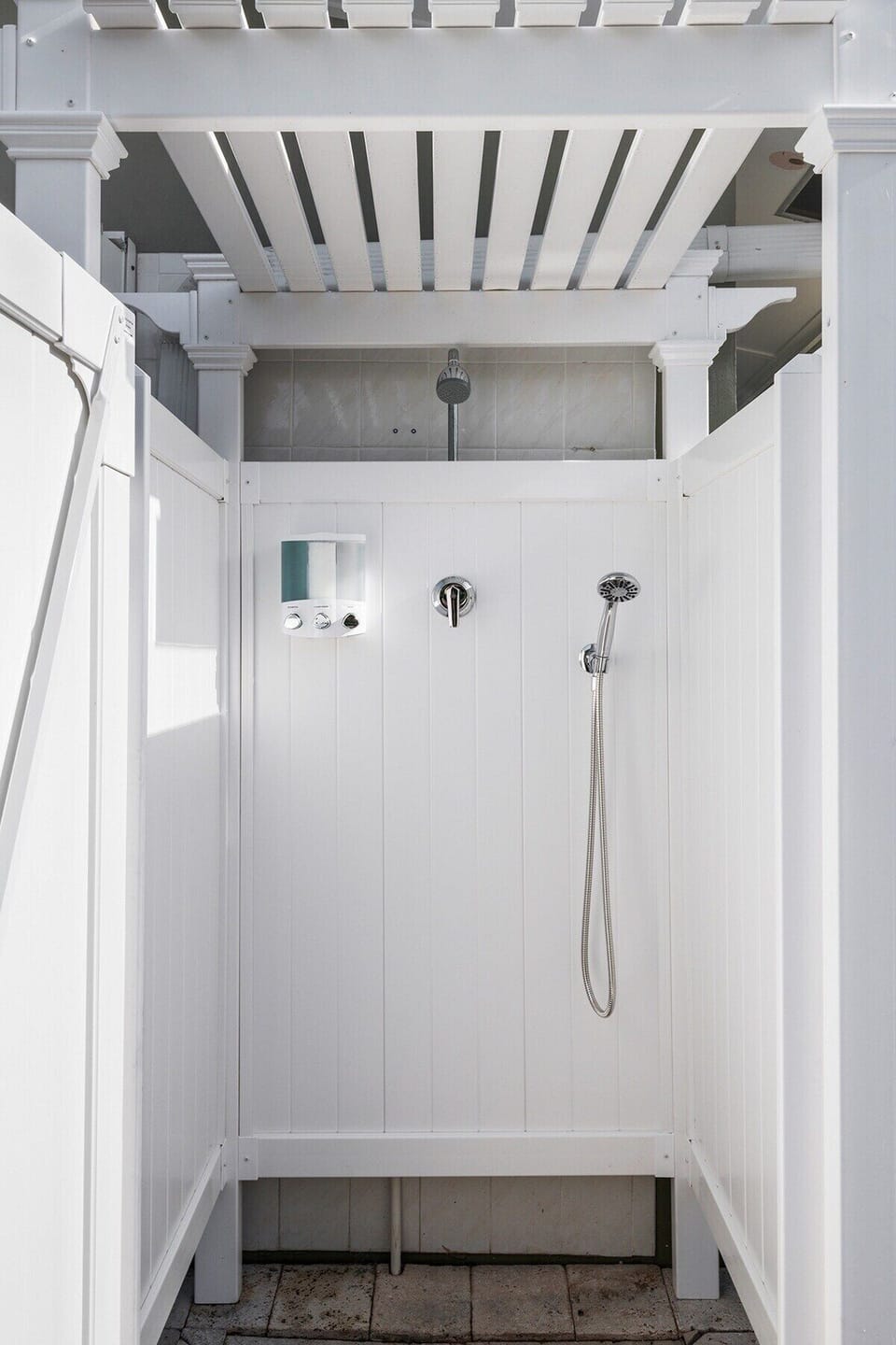 Rinse off in the private outdoor shower with hot/cold water and soaps.