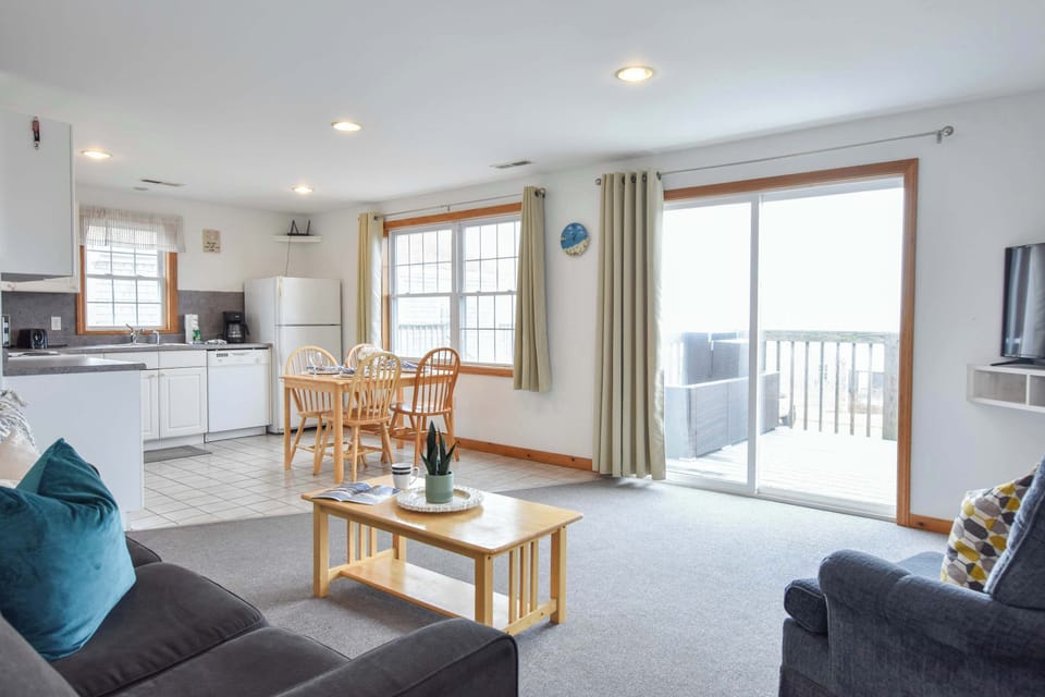 Living area with sliders to deck