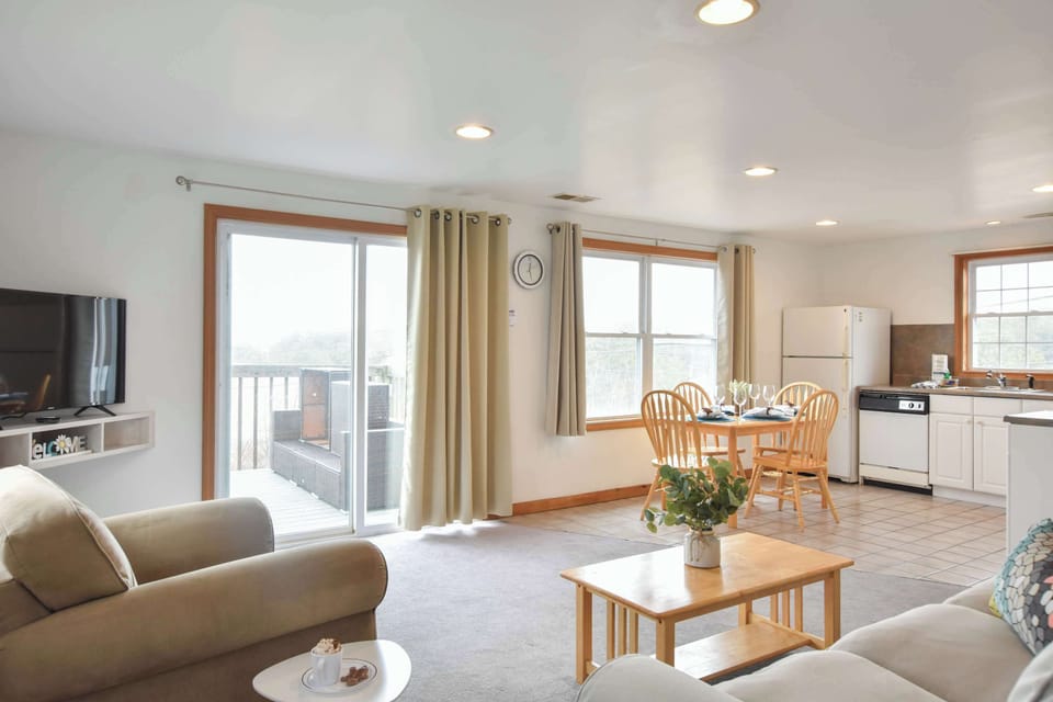 Living room with sliders to deck area