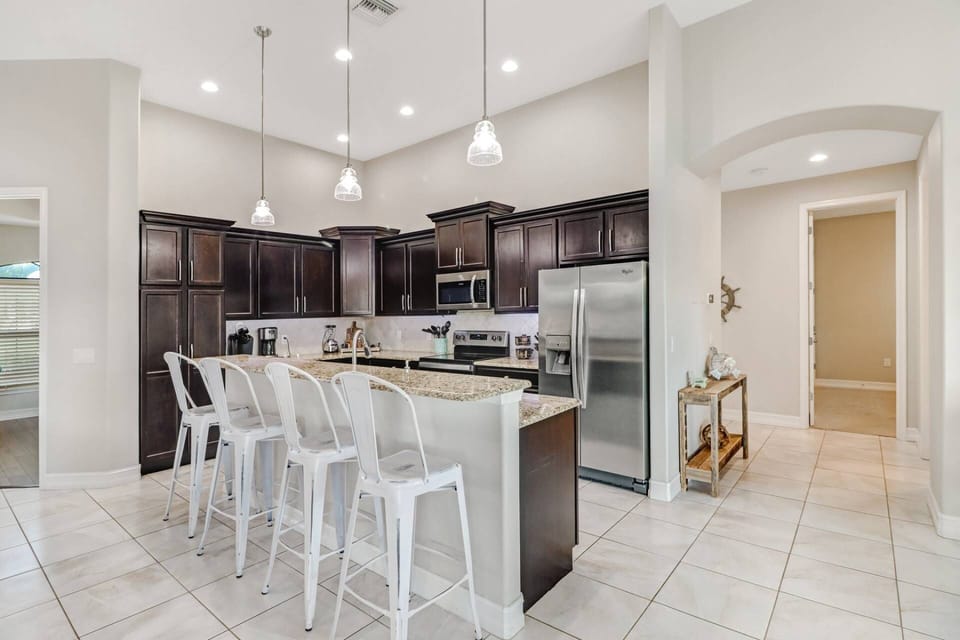 The kitchen is completely open to the living and dining areas, creating a great gathering space.
