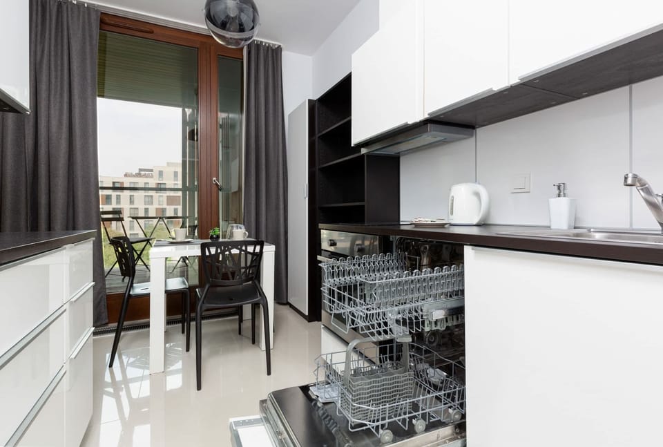 A functional, modern kitchen with high-quality appliances provides the perfect space for preparing home-cooked meals.