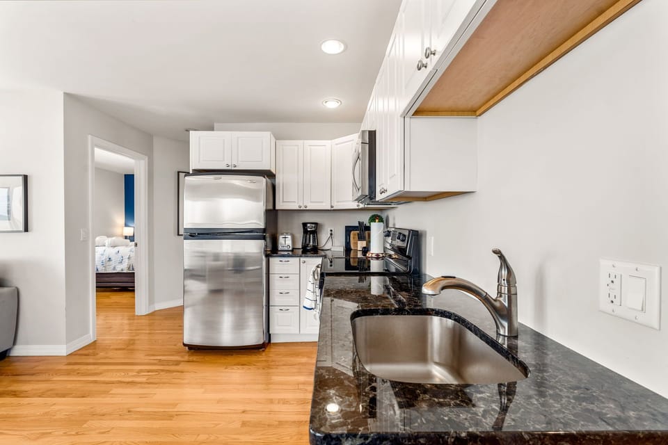 Full kitchen with stainless steel appliances 