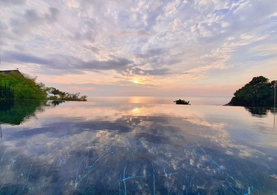 15-meter infinity pool, surrounded by breathtaking sea view and perfect sunset