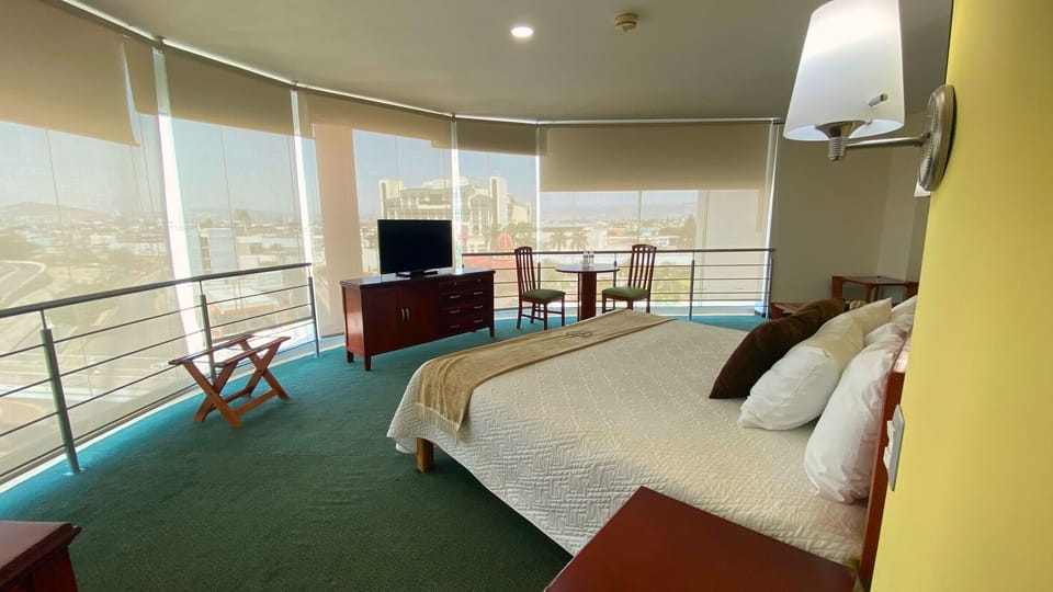 Senior Room, Hot Tub, City View | Desk, laptop workspace, blackout drapes, iron/ironing board