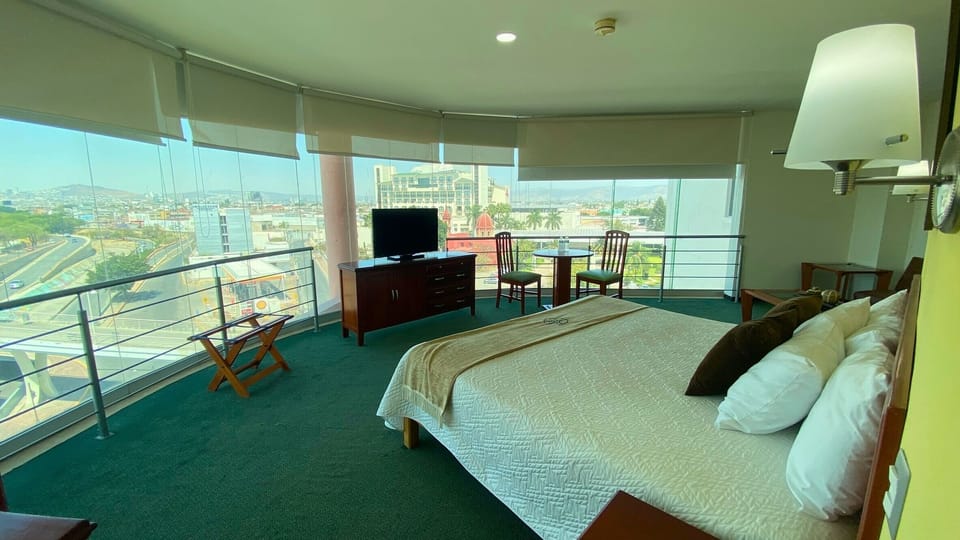 Senior Room, Hot Tub, City View | Desk, laptop workspace, blackout drapes, iron/ironing board