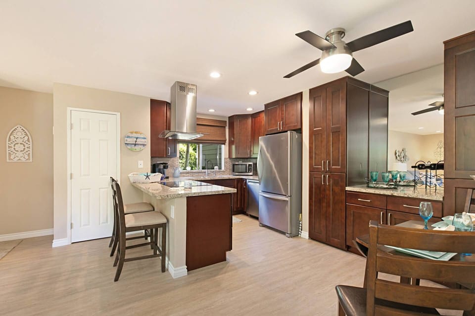 Updated kitchen with new appliances and well stocked with cooking essentials