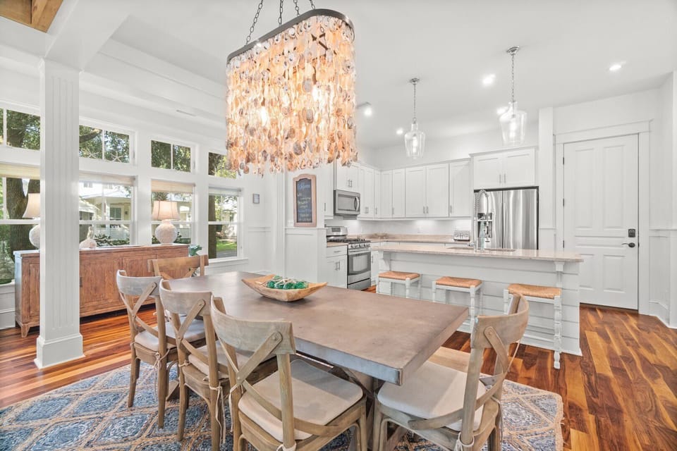 Beautiful oyster shell chandelier is a focal point of the dining and kitchen.