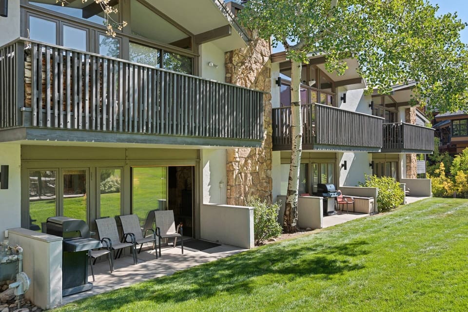 A gas grill and chairs for relaxing are found on your sun drenched patio!