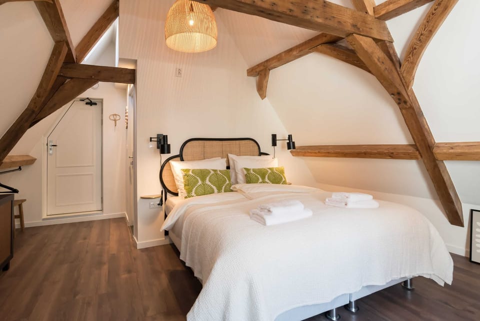 Cozy double bed in romantic attic room