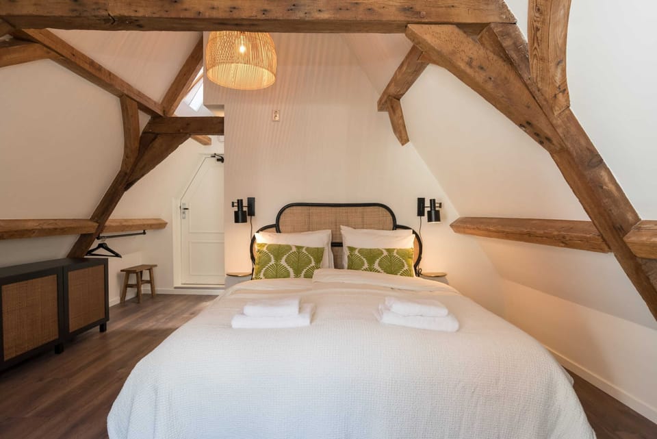 Cozy double bed in romantic attic room