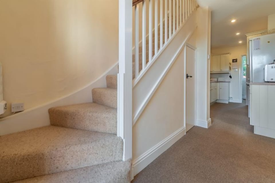 Ground floor: Rear hallway with stairs to first floor