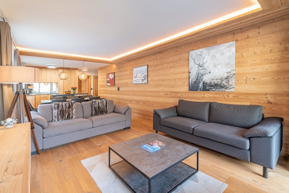 Two-Bedroom Apartment with Matterhorn View (3rd floor) | Living area | 108-inch flat-screen TV with cable channels, TV, heated floors
