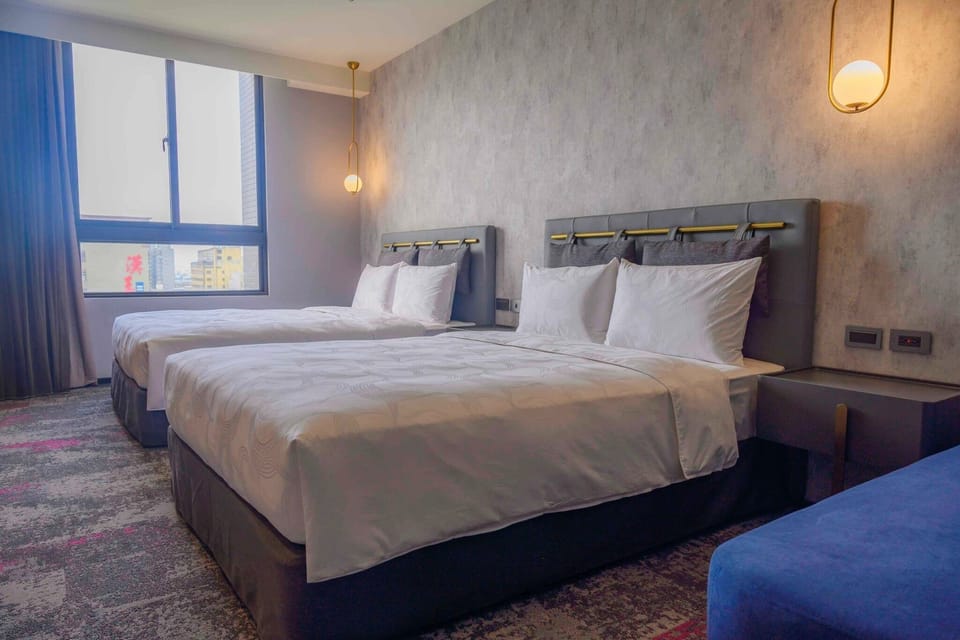Standard Quadruple Room | Desk, laptop workspace, blackout drapes, soundproofing