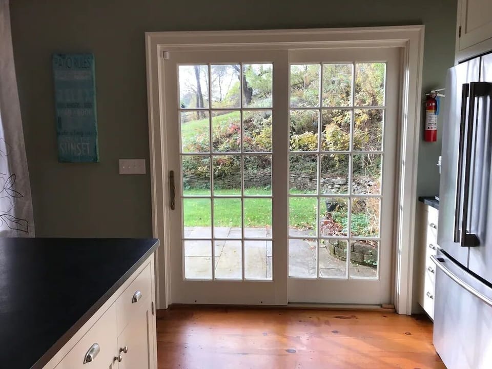 Kitchen doors leading to the gas grill, fire pit and outdoor patio area
