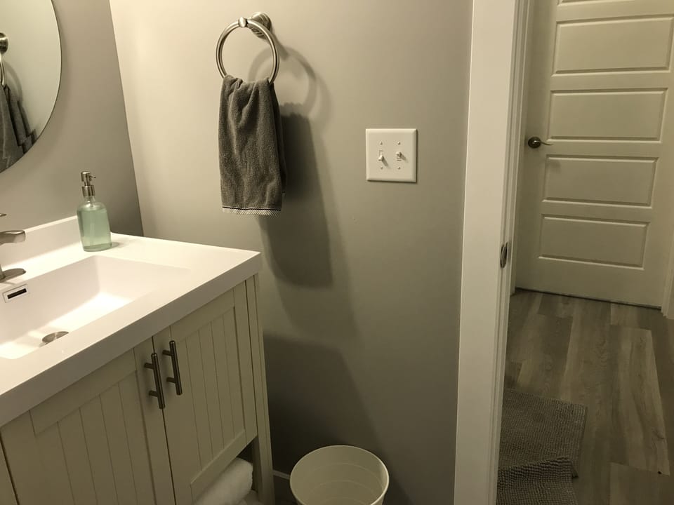 jack n jill bathroom between two bedrooms with  2 private sink areas