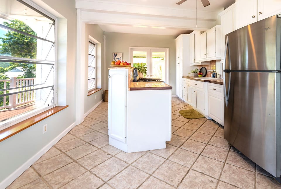 Kitchen with a stainless steel fridge and dishwasher