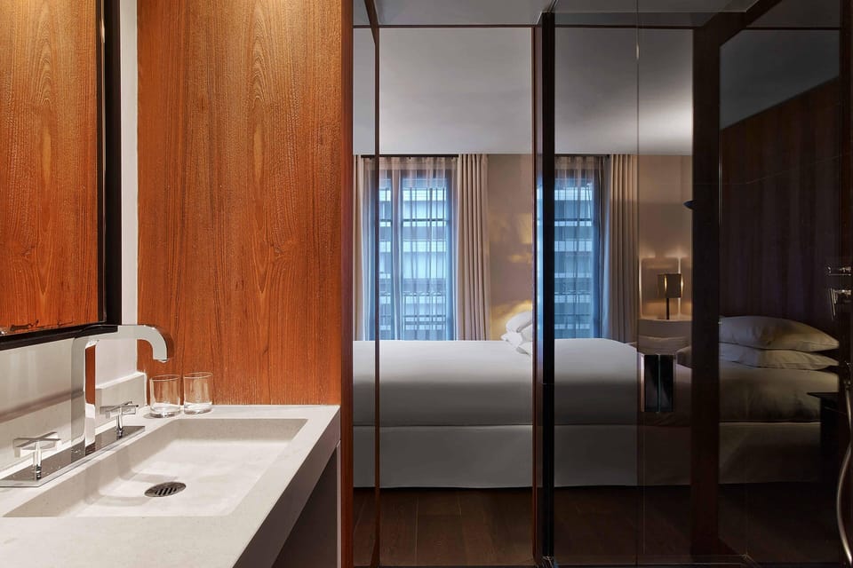 Deluxe Room, 1 Queen Bed | Bathroom | Combined shower/tub, designer toiletries, hair dryer, bathrobes