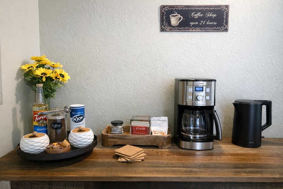 We provide coffee, tea, sugar and sweetner. Regular drip coffee maker and electric kettle.
