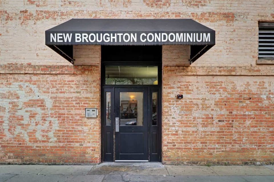 This is the door you will enter on the side of the building on the corner of West Broughton and Montgomery Street