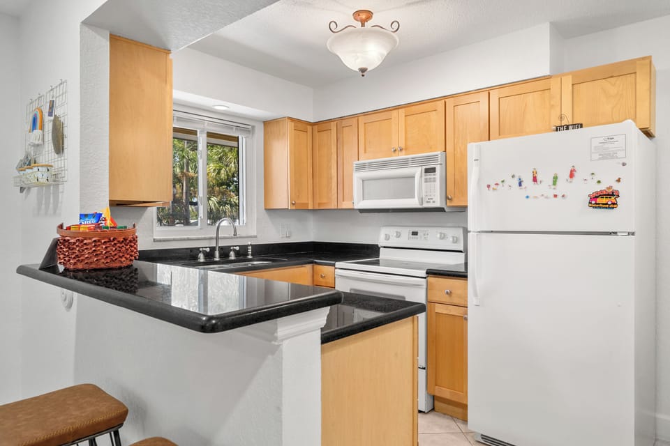 Condo, 1 King Bed with Sofa bed, Pool View (#17 - No Pets) | Private kitchen | Coffee/tea maker, fridge, microwave, oven