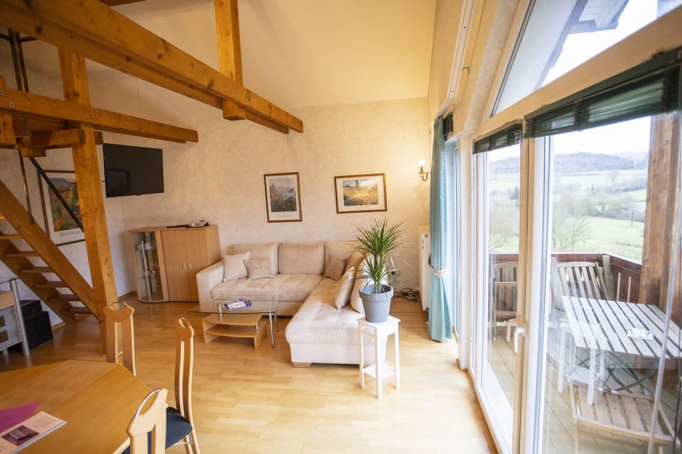 Deluxe Condo | Living area | 60-cm flat-screen TV with satellite channels, TV