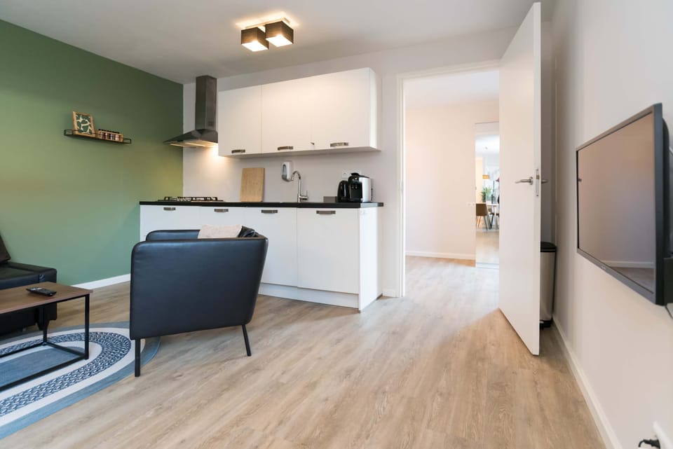 Modern fully equipped kitchen with Nespresso machine, dishwasher, and everything you need for home-cooked meals.