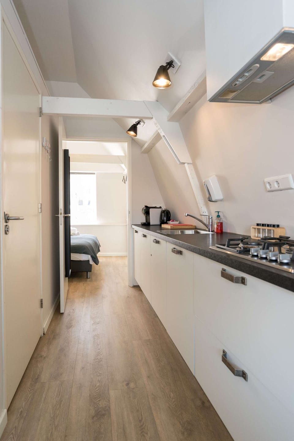 Fully equipped galley-style kitchen with modern appliances.