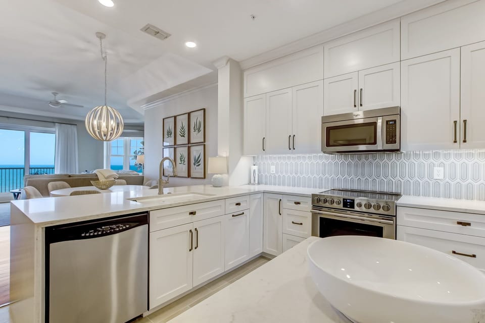Brand New Kitchen With Quartz Countertops, Stylish Tiled Backsplash, Stainless Steel Appliances and Counter Seating for 2