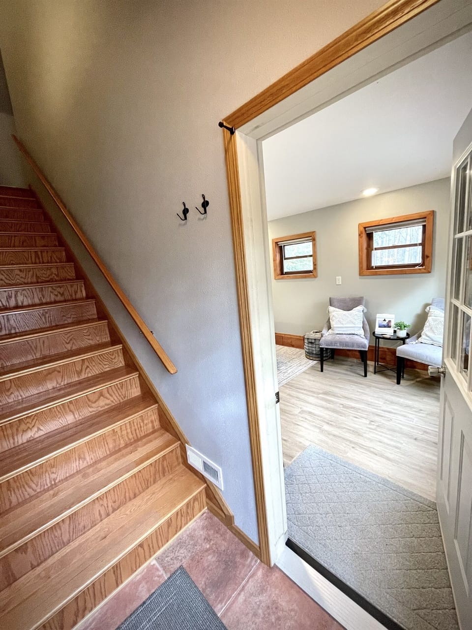 Rock Garden Cottage: Entrance to rock garden cottage lower main level two queen bed bedroom stairs to upper level main living kitchen bathroom 